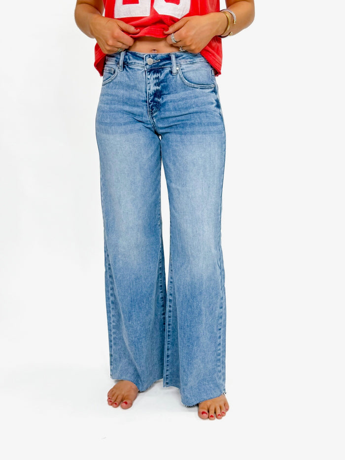 Risen Medium Wash Raw Hem Pallazo Jeans