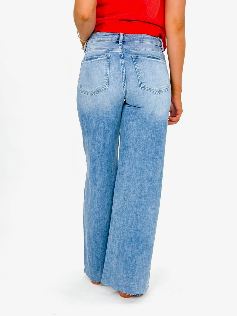 Risen Medium Wash Raw Hem Pallazo Jeans