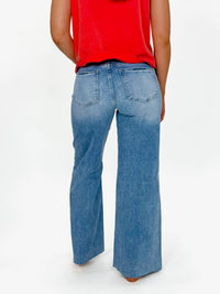 Risen Medium Wash Raw Hem Pallazo Jeans