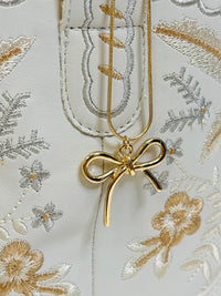 Dorothy Golden Bow Charm Necklace